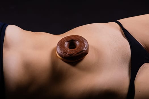 Close up young nice lady woman with slim body perfect skin nude top lingerie stand hold donut