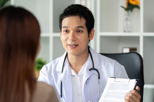 A doctor attentively explaining a treatment plan to a patient, fostering understanding and transparency in a supportive healthcare environment.