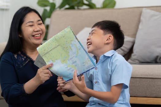 The mother and son are sharing a light-hearted moment as they discuss their travel plans, looking at a map and dreaming of their next adventure.