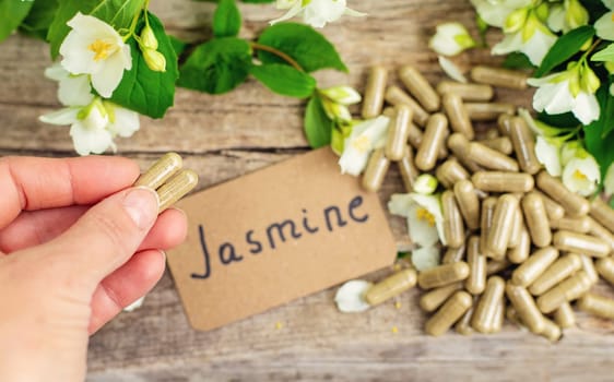 Jasmine essential oil and flowers. Selective focus. nature.