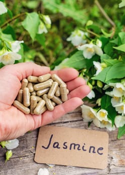 Jasmine essential oil and flowers. Selective focus. nature.