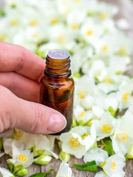 Jasmine essential oil and flowers. Selective focus. nature.