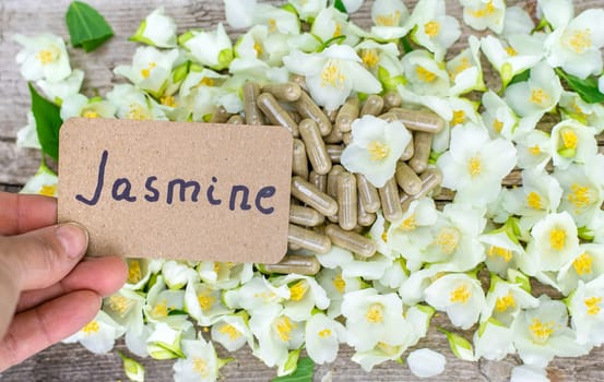 Jasmine essential oil and flowers. Selective focus. nature.