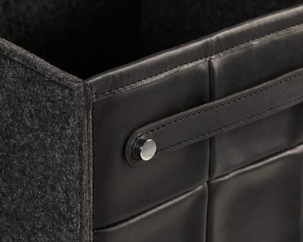 Elegant black leather storage box with a soft felt lining, showcasing refined craftsmanship and a minimalist design