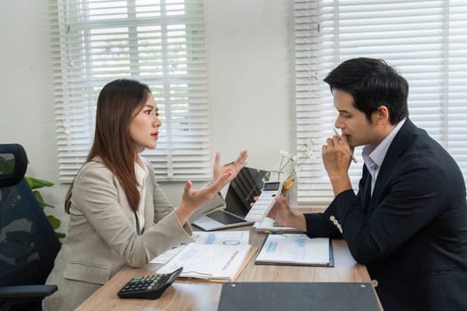 A financial advisor passionately discusses investment options with a client, emphasizing strategy and planning.