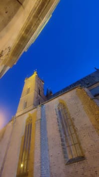 October 22 2024 Hradec Kralove Czech Republic Europe Kralov region, Kralovehradecky kraj. Church tower night building architecture street windows shotlisttravel travel tourism night history historical blue sky landscape . High quality photo