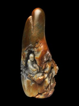 Late 18th-century Chinese carving of a seated Luohan (Arhat) holding a fan, in variegated jade. Expressive detail, spiritual representation.