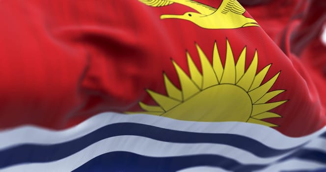 Close-up of Kiribati national flag waving in the wind. Kiribati is an independent island nation in the central Pacific Ocean. 3d illustration render. Selective focus