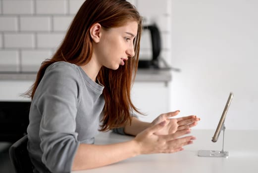 Unhappy Teen Girl Looking At Smartphone At Home