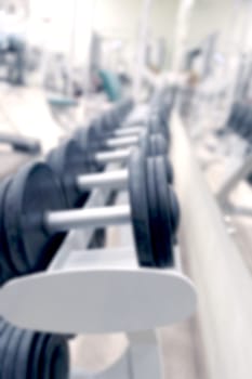 First Part Blurred Dumbbell Racks In A Gym And Out Of Focus