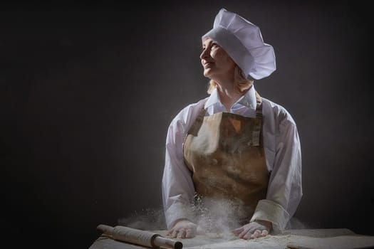 An elderly woman in a chef\'s hat smiles as she joyfully prepares dough from flour, creating a lighthearted atmosphere in the kitchen.