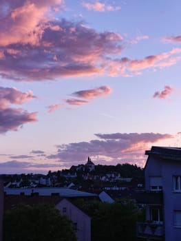 View of Fulda with Frauenberg Monastery during the golden hour at sunset. High quality photo