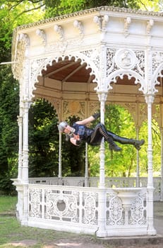 Fantasy shot of a dark elf on the pole of an old pavilion