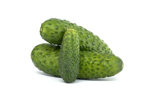 Close-up view of fresh green cucumbers with bumpy skin, isolated on a white background, showcasing their texture and freshness. Perfect for concepts related to produce, nutrition, and healthy eating.