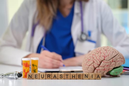 A dedicated healthcare professional carefully examines neurasthenia using brain and medication props during assessment