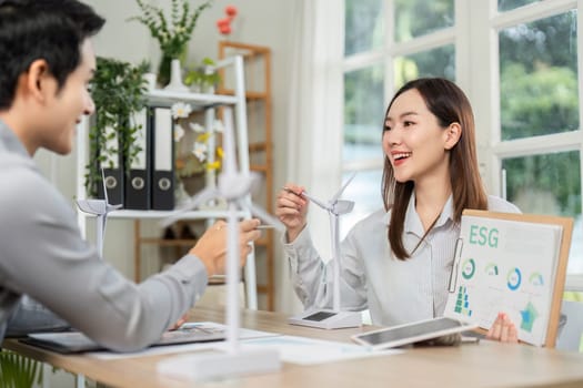 A woman shares insights on ESG strategies during a consultation, emphasizing corporate responsibility and environmental impact.