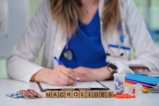 A healthcare professional discusses the usage and effects of macrolide antibiotics in a clinical setting