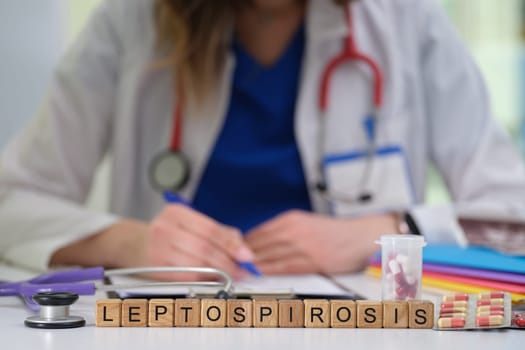 A dedicated healthcare professional is focused on diagnosing leptospirosis using medical tools and detailed notation