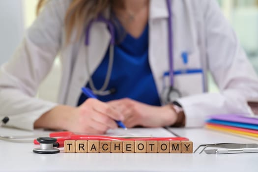 A skilled medical professional documents crucial details of a tracheotomy, highlighting the importance of patient care