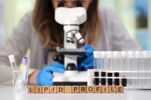 An analysis of lipid profiles using advanced microscopes, highlighting lab equipment and blood sample analysis