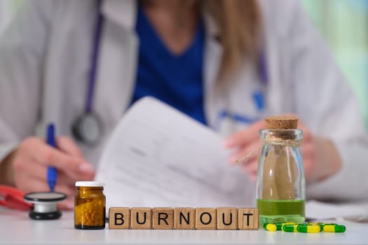 A healthcare professional faces burnout, symbolized by medications and notes, highlighting their path to recovery