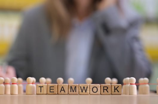This illustration highlights teamwork with blocks and mini figurines, promoting unity and connection