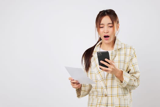 Stressed woman holding bill and phone shows reaction to financial struggles and financial payment issues. isolated studio white background