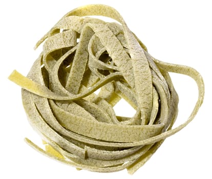 Nest of dry green egg pasta tagliatelle with spinach, isolated background