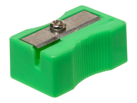 Green plastic pencil sharpener with metal blade on isolated background