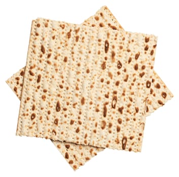 Two sheets of matzah stacked on top of each other, isolated on background. Top view
