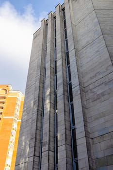 bottom view of city brick buildings on sunny spring day