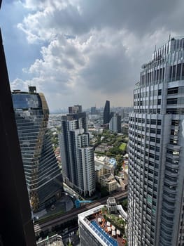 Skyscrapers in Thailand capital with skyline views in city center, downtown corporate area with breathtaking infrastructure for urban growth. Modern towers in the Bangkok metropolis.