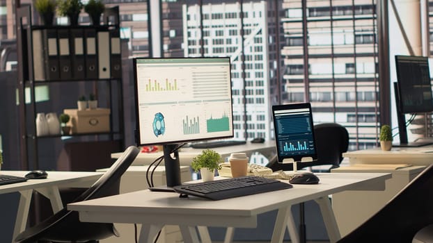 Empty business office with cubicles used in organizational activity efficiency, having advanced tech gadgets to serve a corporation with luxurious city center headquarters. Corporate culture.