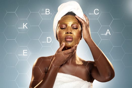 In a contemporary wellness studio, a woman is applying a gold facial mask. She appears relaxed and focused, emphasizing the mask's skincare benefits. The ambiance promotes rejuvenation and self-care.