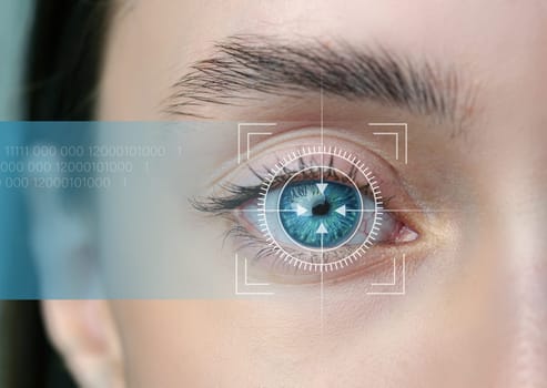 A human eye is focused on while digital scanning technology overlays are visible, indicating biometric identification. This showcases advancements in eye recognition systems.