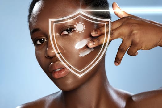 A woman applies sunscreen to her face, demonstrating a skin care routine focused on sun protection. Soft lighting highlights the importance of skincare and healthy glowing skin.