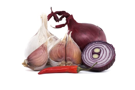 A close-up view of fresh garlic, red onion, and chili pepper isolated on pure white background.
