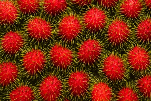 AI generated top view of fresh rambutans with water droplets under bright daylight showing vibrant color and clean texture perfect for tropical fruit and freshness concepts