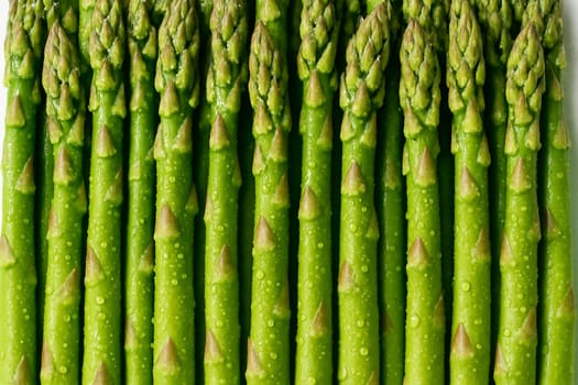 AI generated top view of fresh asparagus with water droplets in bright daylight showing vibrant color and freshness suitable for food and organic concept