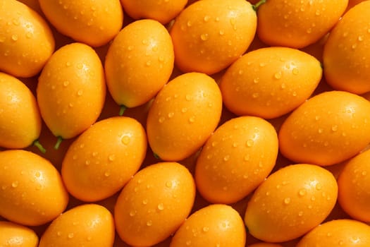 AI generated top view of fresh ripe mayong chid with water droplets on smooth skin reflecting daylight for a clean vibrant and appetizing look