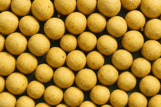 AI generated top view of fresh longkongs with water droplets under bright daylight showcasing clean texture and natural color ideal for tropical fruit and freshness concept
