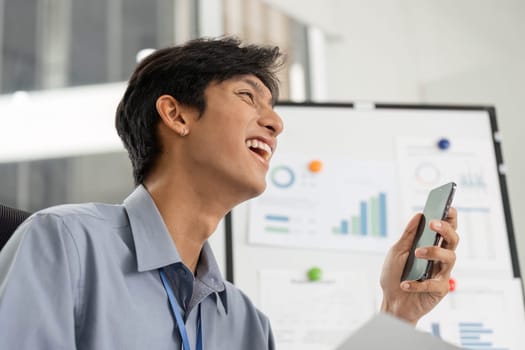 A cheerful business professional enjoying a video call, showcasing positive communication and remote work dynamics.