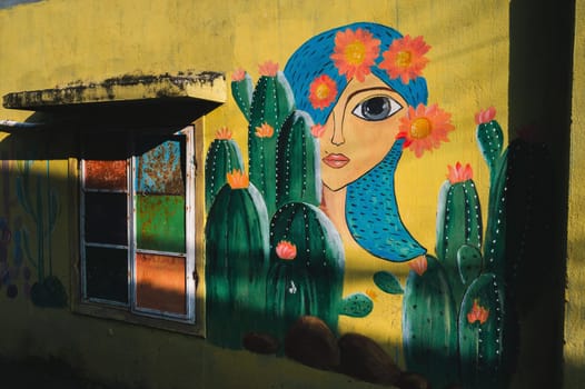 Graffiti portrait of a woman on wall of a house in the Murals Paintings Fishing Village Tam Thanh in Quang Nam province in Vietnam. Tam Thanh, Quang Nam province, Vietnam - April 10, 2025