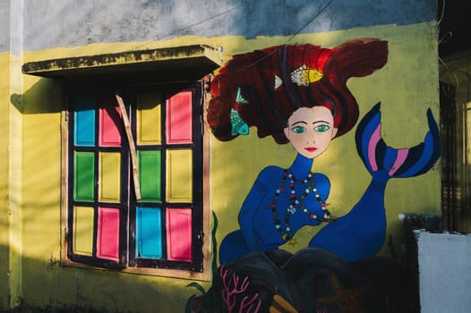 Graffiti mermaid on the wall of house in Murals Paintings Fishing Village Tam Thanh in Quang Nam province in Vietnam. Tam Thanh, Quang Nam province, Vietnam - April 10, 2025