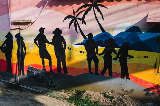 Graffiti from Vietnamese fishermen on wall of house in Murals Paintings Fishing Village Tam Thanh in Quang Nam province in Vietnam. Tam Thanh, Quang Nam province, Vietnam - April 10, 2025