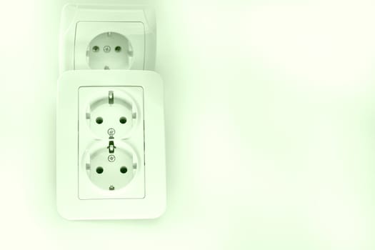 able to be connected by means of a plug. an electrical device receiving a plug or light bulb to make a connection