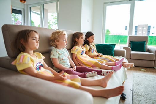 Four kids enjoy quiet time in a sunny setting.