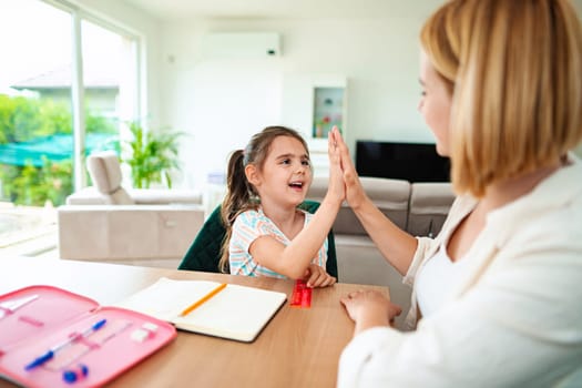 A child enjoys a playful interaction while learning at home.