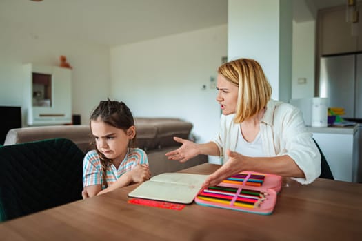 Parent expresses frustration while child looks away sadly