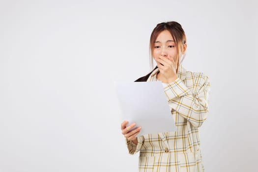 Holding multiple bills, she appears shocked by her financial situation, uncertain how to manage financial obligations without more income. isolated studio white background